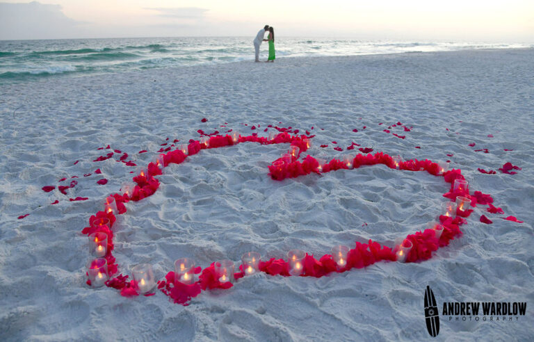 A heart made out of rose petals and candles is seen after a beach proposal session in Panama City Beach. 