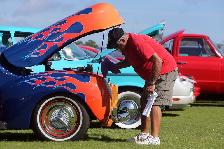 Ron Rabiansky shines up his 1939 Ford at the Emerald Coast Cruizin' car show in Panama City Beach. (Panama City Beach Photographer | Andrew Wardlow)