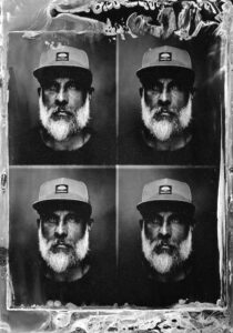 A tintype photo of a man taken with a Polaroid passport camera in Panama City Beach, Florida.
