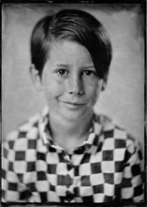 Tintype or wet plate photograph of a young boy.