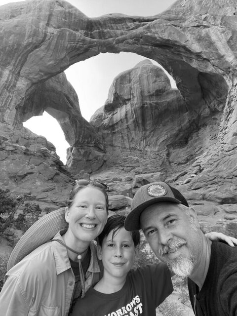 A family takes a self-portrait at Arches National Park in Utah. 