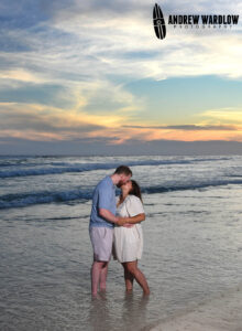 A couple share a kiss at sunset along Panama City Beach.