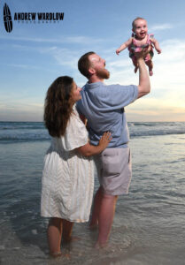A family enjoys getting a photo taken in Panama City Beach, Florida.