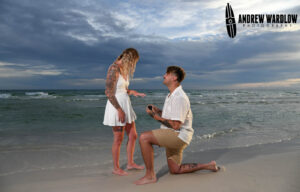 A young couple gets engaged as they are photographed by Panama City Beach photographer Andrew Wardlow.