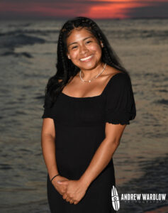 A woman smiles while being photographed in Panama City Beach.