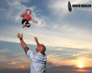 A baby laughs happily as it is being photographed in Panama City Beach, Florida.