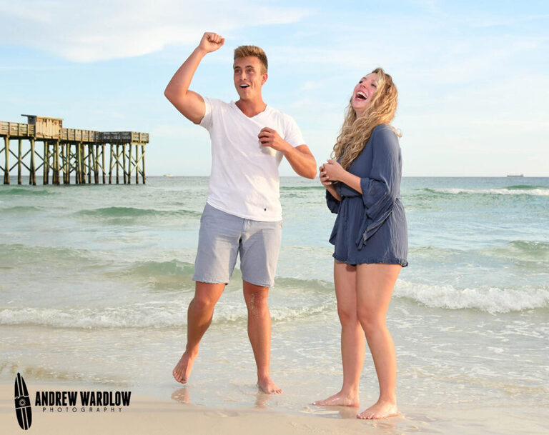 A couple celebrates after getting engaged at St. Andrew's State Park in Panama City Beach, Florida.