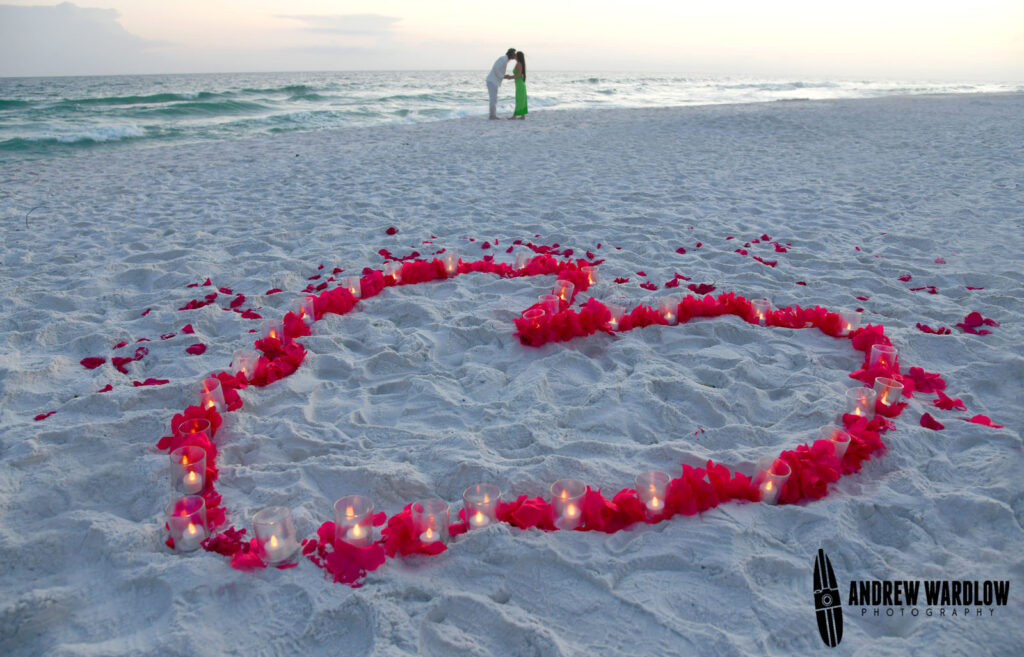 A heart made out of rose petals and candles is seen after a beach proposal session in Panama City Beach.