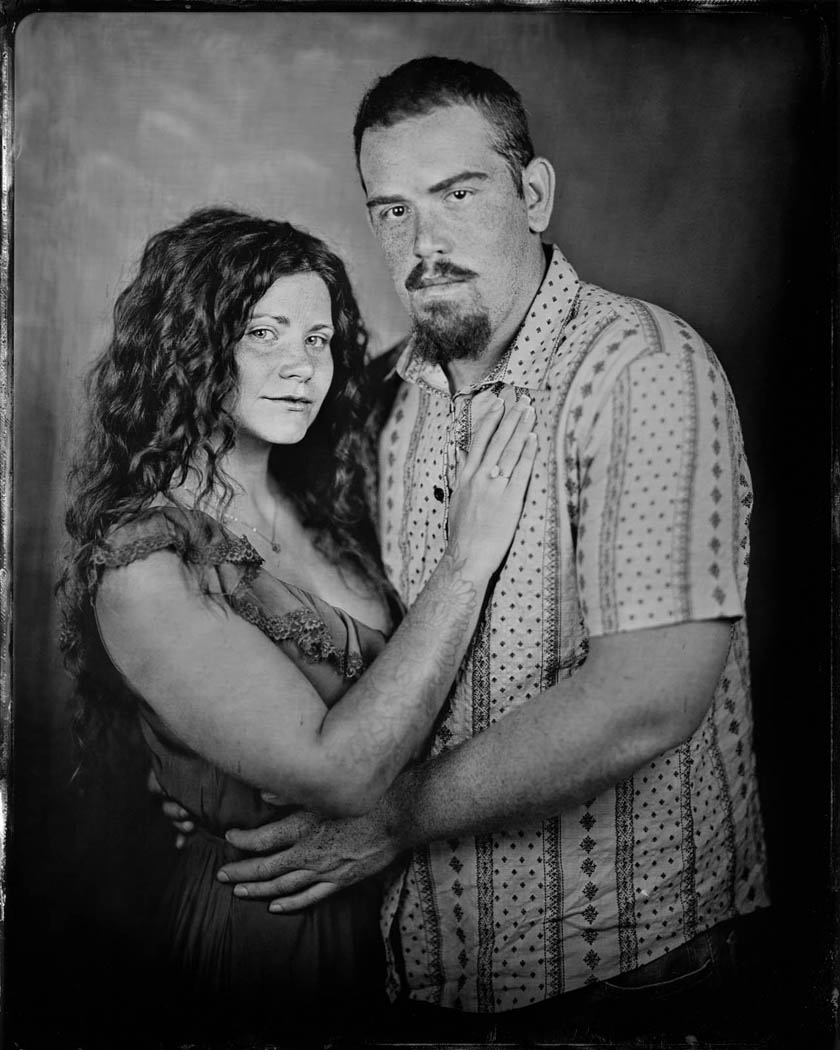 A couple is seen embracing in a tintype photo taken in my Panama City Beach tintype studio.